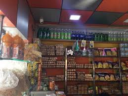 Clean and organized interior of Krishna Dairy and General Store